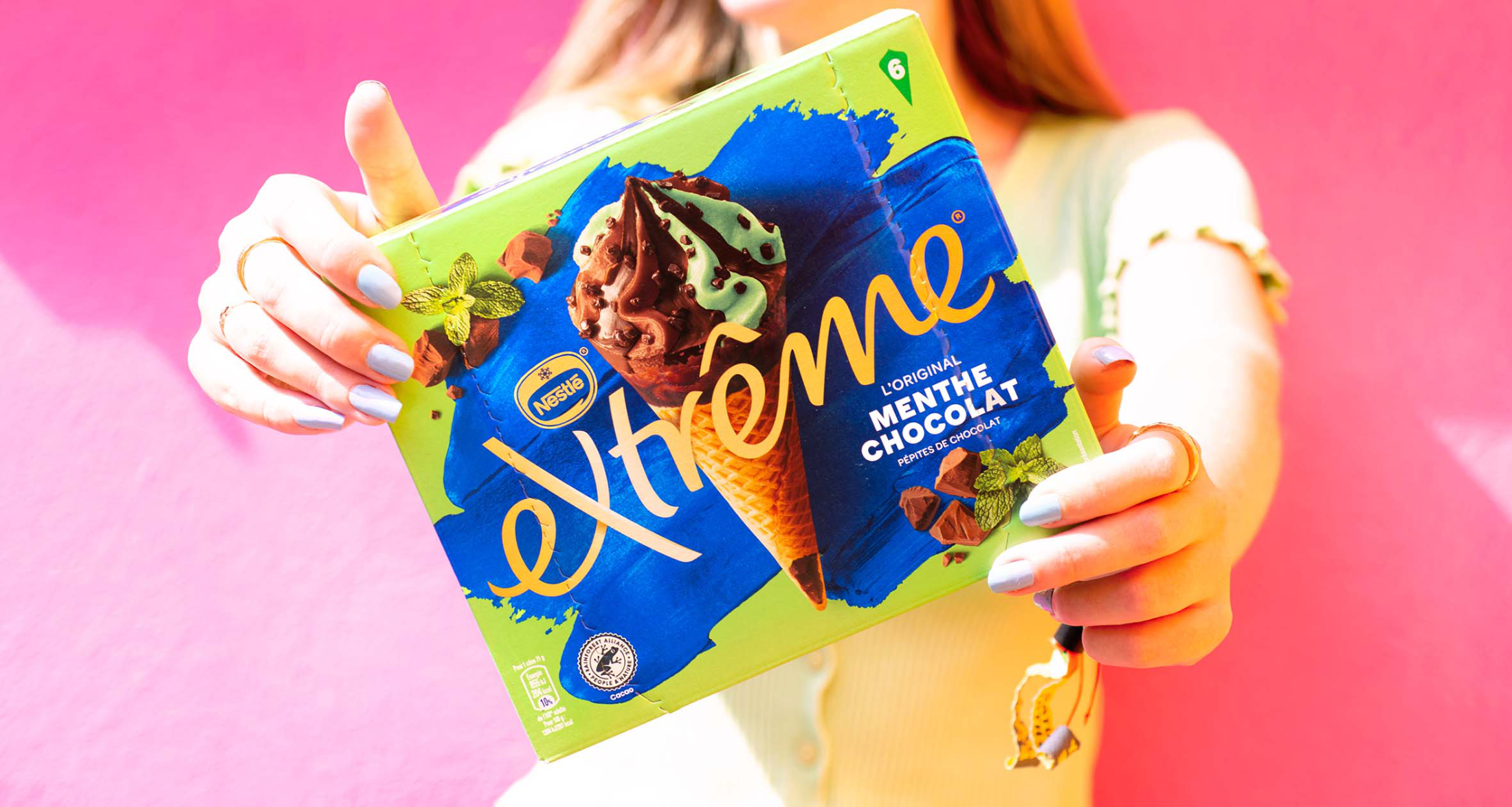 Lady holding up mint choc ice cream box