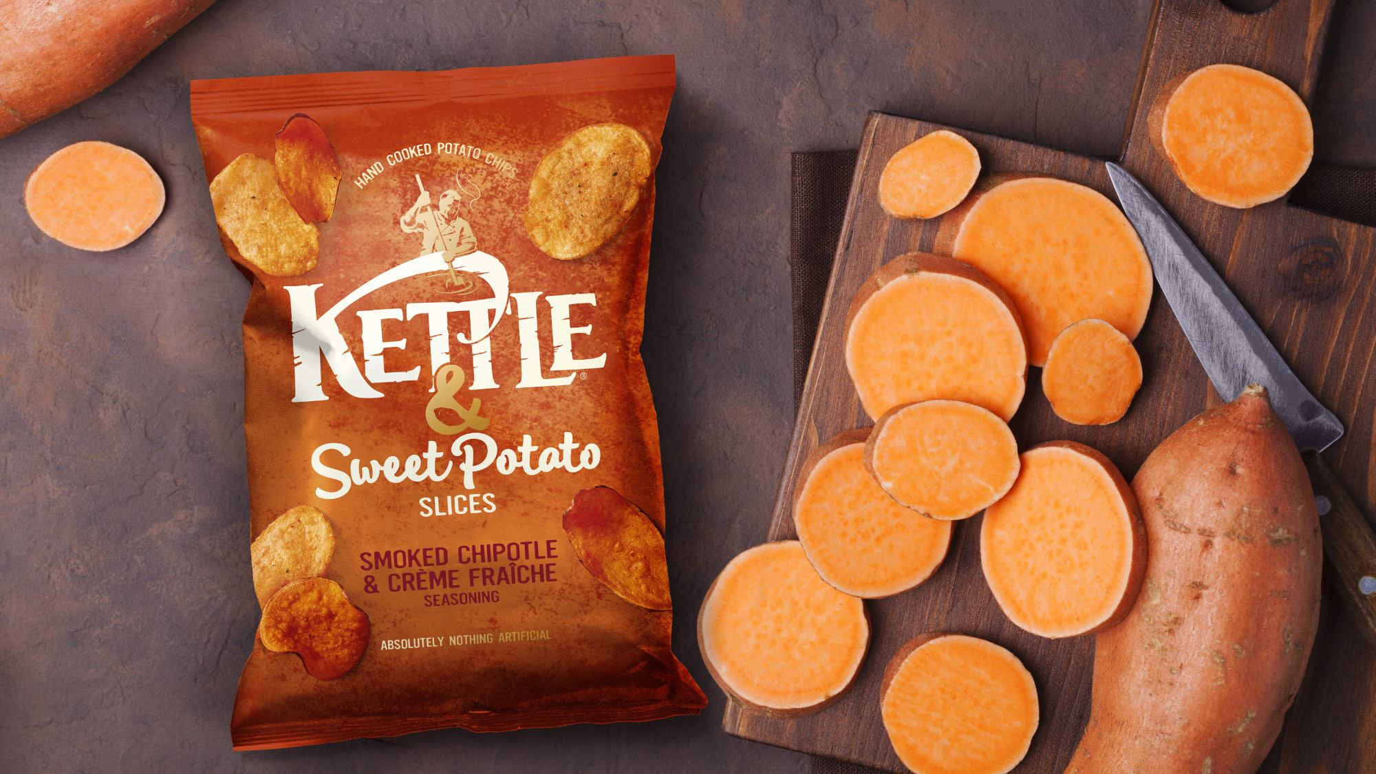 Kettle pack with raw Sweet Potatoes on chopping board